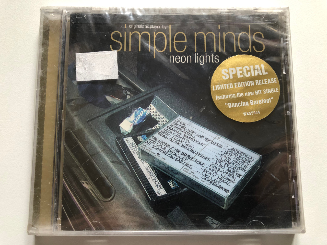 https://cdn11.bigcommerce.com/s-62bdpkt7pb/products/0/images/327130/Simple_Minds_Neon_Lights_Special_Limited_Edition_Release_featuring_the_new_hit_single_Dancing_Barefoo_Eagle_Records_Audio_CD_2001_WK55944_1__70317.1710426311.1280.1280.JPG?c=2