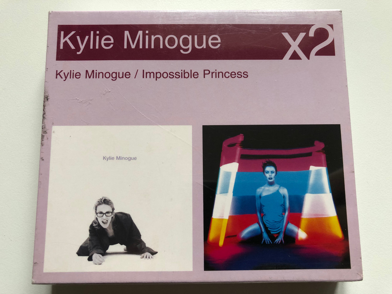 https://cdn11.bigcommerce.com/s-62bdpkt7pb/products/0/images/327133/Kylie_Minogue_Kylie_Minogue_Impossible_Princess_Sony_BMG_Music_Entertainment_2x_Audio_CD_2005_82876719712_1__99205.1710428604.1280.1280.JPG?c=2