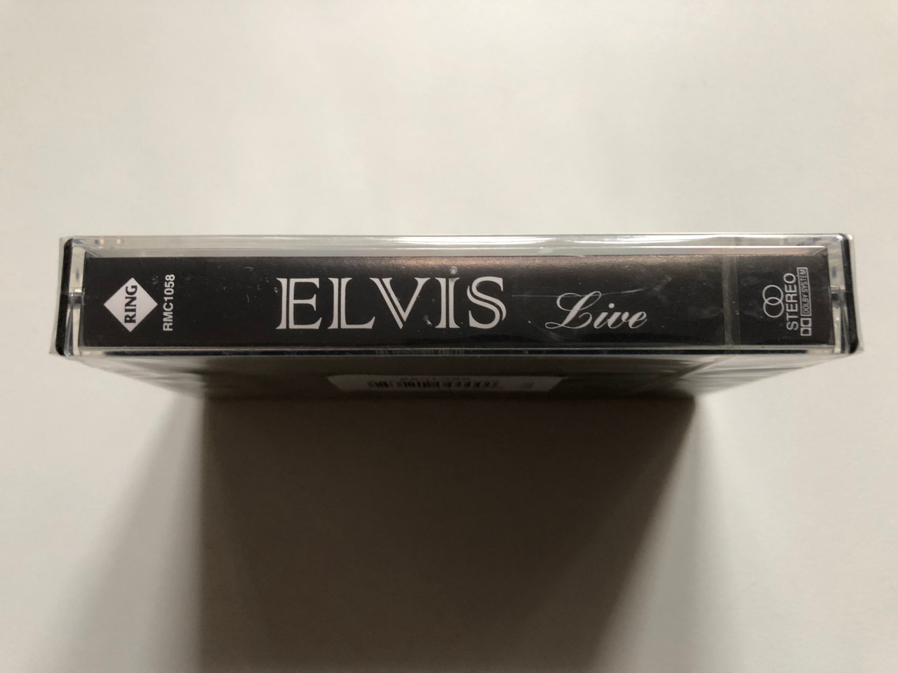 https://cdn11.bigcommerce.com/s-62bdpkt7pb/products/0/images/327142/Elvis_Live_Ring_Audio_Cassette_Stereo_RMC_1058_3__31916.1710429194.1280.1280.JPG?c=2