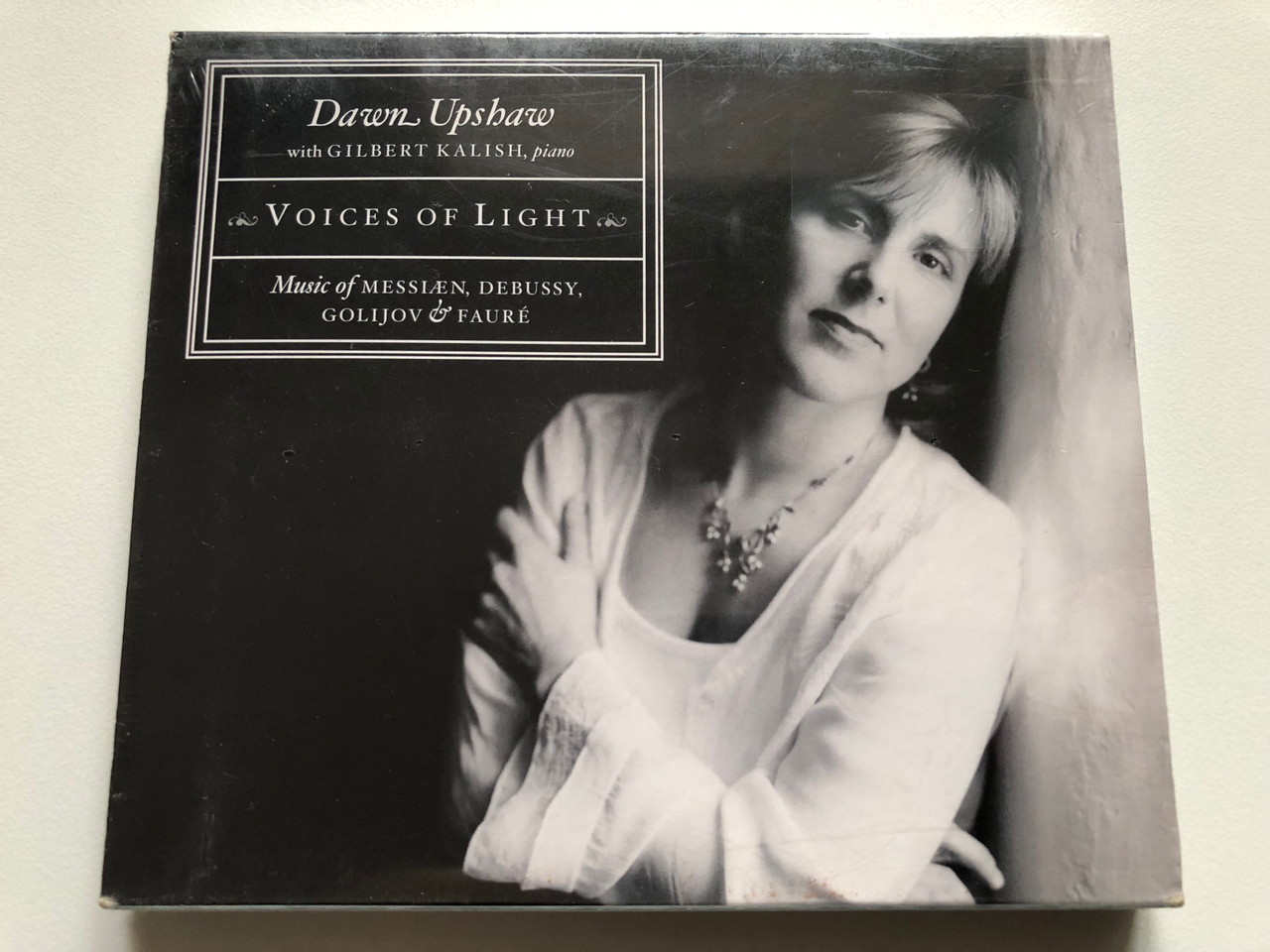 https://cdn11.bigcommerce.com/s-62bdpkt7pb/products/0/images/327146/Dawn_Upshaw_With_Gilbert_Kalish_piano_-_Voices_Of_Light_Music_of_Messiaen_Debussy_Golijov_Faure_Nonesuch_Audio_CD_7559-79812-2_1__23837.1710429978.1280.1280.JPG?c=2