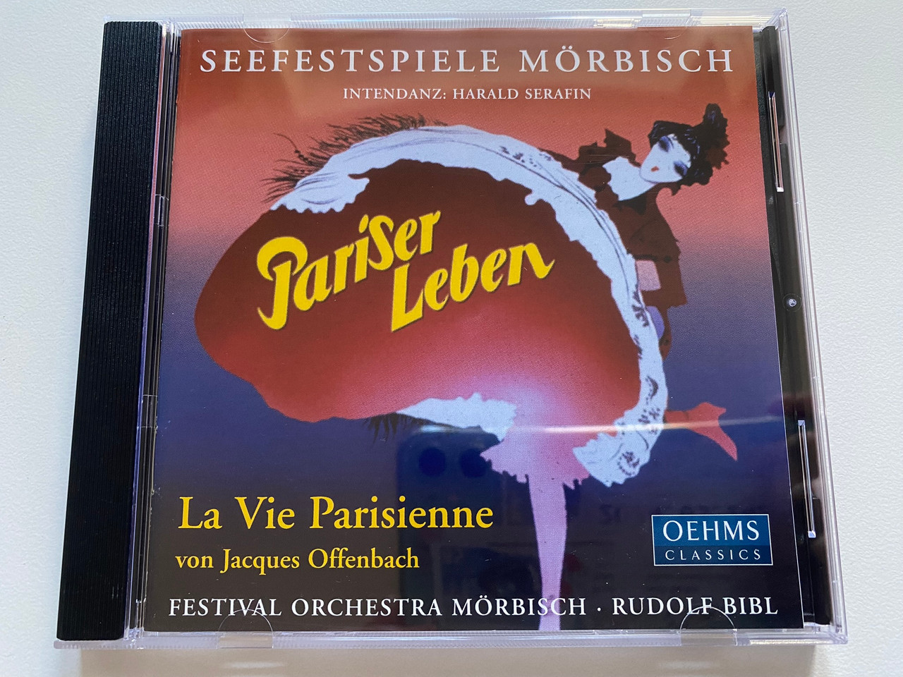 https://cdn11.bigcommerce.com/s-62bdpkt7pb/products/0/images/328091/Pariser_Leben_La_Vie_Parisienne_von_Jacques_Offenbach_-_Seefetspiele_Morbisch_Intendanz_Harald_Serafin_Festival_Orchestra_Mrbisch_Rudolf_Bibl_Oehms_Classics_Audio_CD_2002_OC_252_1__18589.1710832677.1280.1280.jpg?c=2