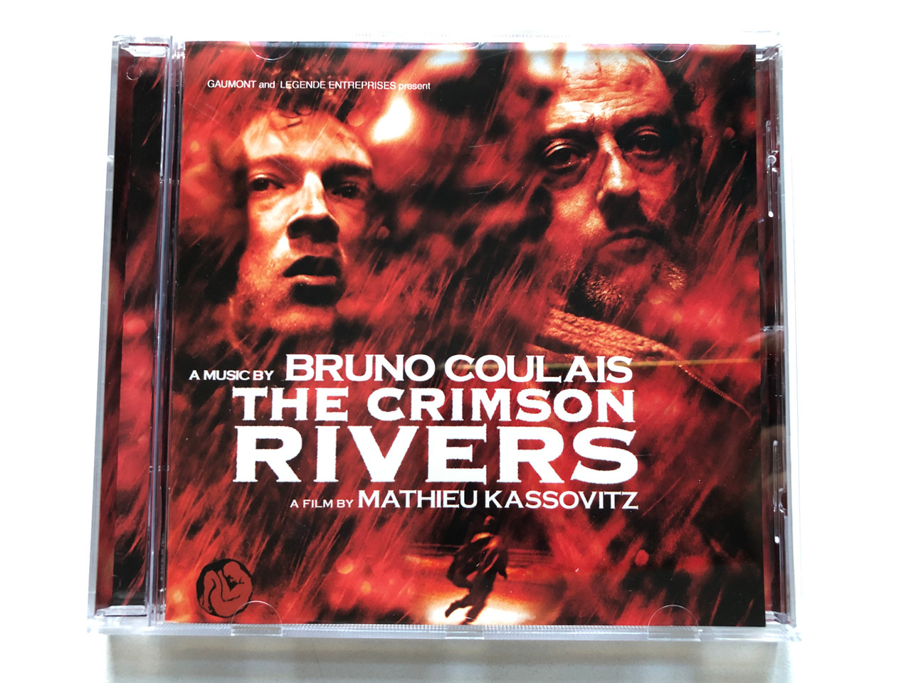 https://cdn11.bigcommerce.com/s-62bdpkt7pb/products/0/images/328665/Gaumont_and_Legende_Entreprises_present_Music_by_Bruno_Coulais_The_Crimson_Rivers_-_A_Film_By_Mathieu_Kassovitz_Virgin_Audio_CD_2000_724385047022_1__01869.1711019871.1280.1280.JPG?c=2