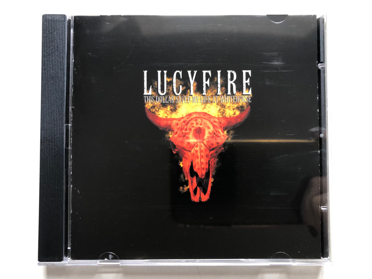 https://cdn11.bigcommerce.com/s-62bdpkt7pb/products/0/images/328679/Lucyfire_This_Dollar_Saved_My_Life_At_Whitehorse_Oblivion_Audio_CD_2001_SPV_085-72212_CD_1__72727.1711085946.1280.1280.JPG?c=2