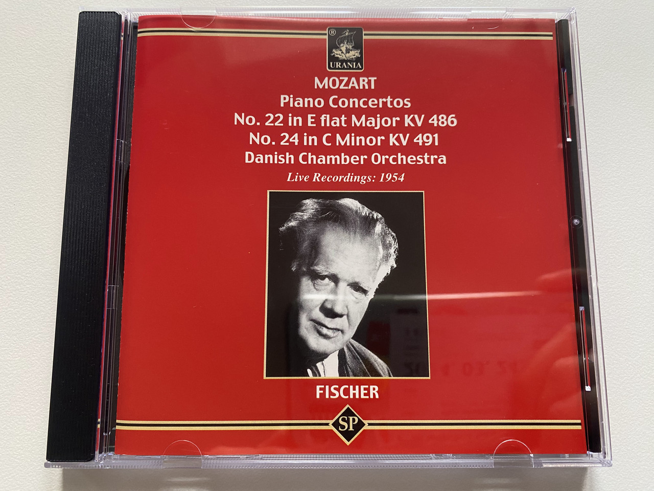https://cdn11.bigcommerce.com/s-62bdpkt7pb/products/0/images/329611/Fischer_-_Mozart_Piano_Concertos_No._22_in_E_flat_Major_KV_486_No._24_in_C_Minor_KV_491_-_Danish_Chamber_Orchestra_Live_Recordings_1954_Urania_Audio_CD_2004_Mono_SP_4220_1__80815.1711566246.1280.1280.JPG?c=2
