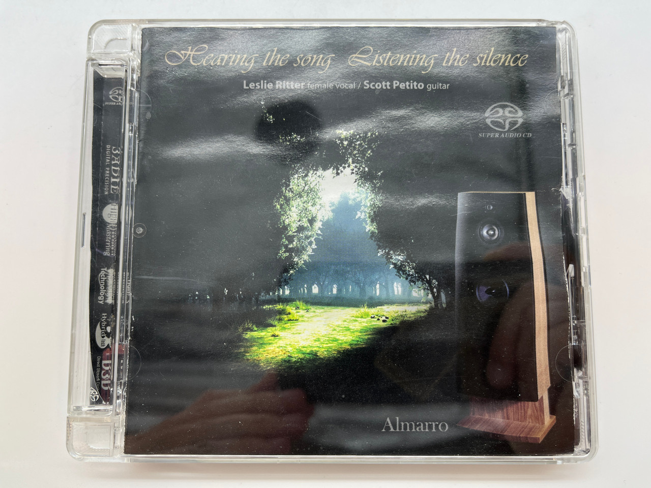 https://cdn11.bigcommerce.com/s-62bdpkt7pb/products/0/images/331773/Hearing_the_song_Listening_the_silence_-_Leslie_Ritter_female_vocal_Scott_Petito_guitar_Almarro_Hudson_Valley_Records_Audio_CD_2007_TM-SACD9011_2__83473.1713874360.1280.1280.JPG?c=2