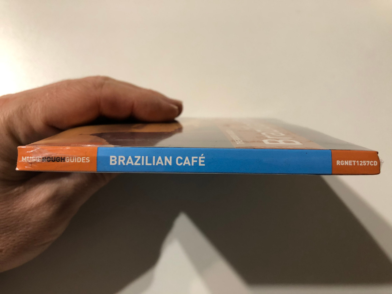https://cdn11.bigcommerce.com/s-62bdpkt7pb/products/0/images/331854/The_Rough_Guide_To_Brazilian_Caf_World_Music_Network_2x_Audio_CD_2011_RGNET1257CD_3__31797.1713947668.1280.1280.JPG?c=2