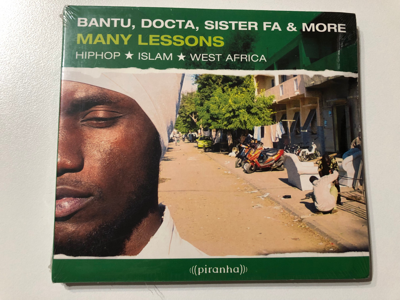 https://cdn11.bigcommerce.com/s-62bdpkt7pb/products/0/images/331894/Bantu_Docta_Sister_Fa_More_Many_Lessons_-_Hiphop_Islam_West_Africa_Piranha_Audio_CD_2008_CD-PIR2112_1__18352.1713974422.1280.1280.JPG?c=2