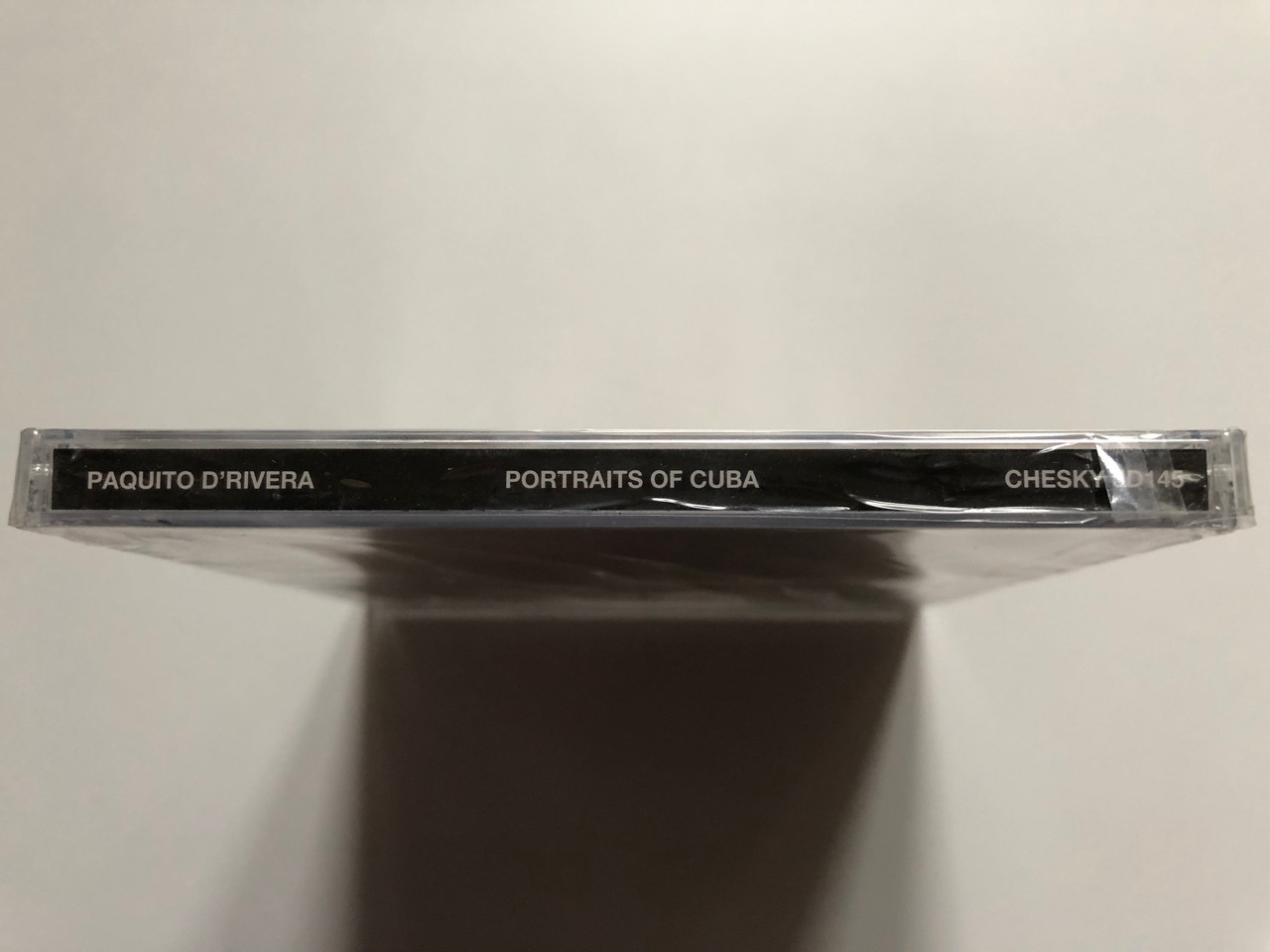 https://cdn11.bigcommerce.com/s-62bdpkt7pb/products/0/images/332425/Paquito_DRivera_Portraits_Of_Cuba_-_Arranged_and_Conducted_By_Carlos_Franzetti_Chesky_Records_Audio_CD_1996_JD145_3__53577.1714421950.1280.1280.JPG?c=2