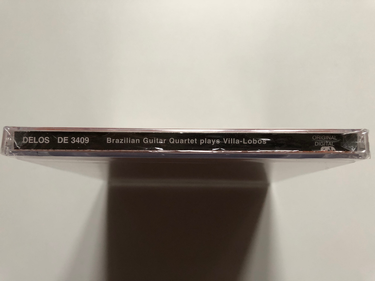 https://cdn11.bigcommerce.com/s-62bdpkt7pb/products/0/images/332622/Brazilian_Guitar_Quartet_Plays_Villa-Lobos_Delos_Audio_CD_2011_DE_3409_3__69248.1714470987.1280.1280.JPG?c=2