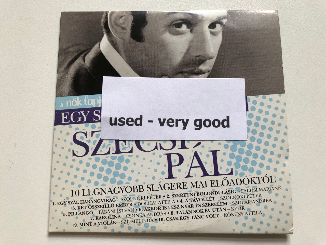 https://cdn11.bigcommerce.com/s-62bdpkt7pb/products/0/images/333011/Egy_Szl_Harangvirg-_Szcsi_Pl_10_Legnagyobb_Slgere_Mai_Eladktl_Universal_Music_Group_Audio_CD_2012_3715230_4__44087.1714986279.1280.1280.JPG?c=2