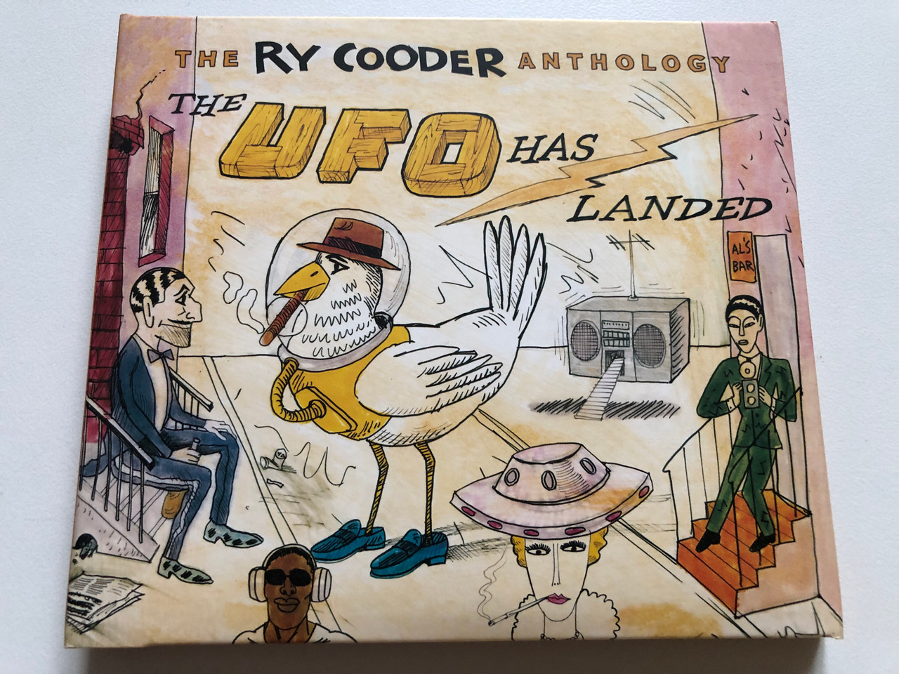 https://cdn11.bigcommerce.com/s-62bdpkt7pb/products/0/images/336725/The_Ry_Cooder_Anthology_The_UFO_Has_Landed_Rhino_Records_2x_Audio_CD_2008_R2_515893_1__54468.1718260277.1280.1280.JPG?c=2