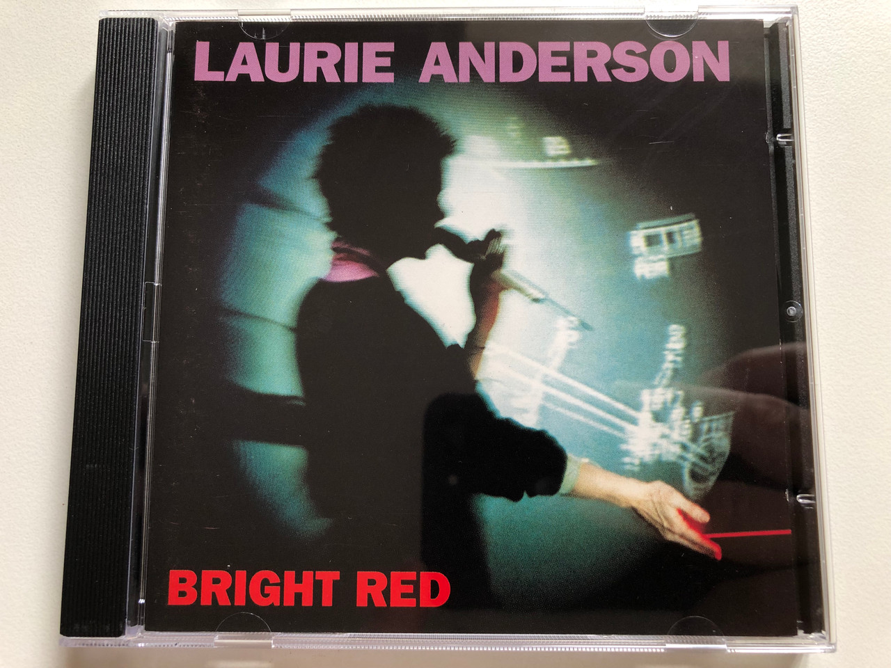 https://cdn11.bigcommerce.com/s-62bdpkt7pb/products/0/images/337288/Laurie_Anderson_Bright_Red_Warner_Bros._Records_Audio_CD_1994_9362-45534-2_1__64479.1718806234.1280.1280.JPG?c=2
