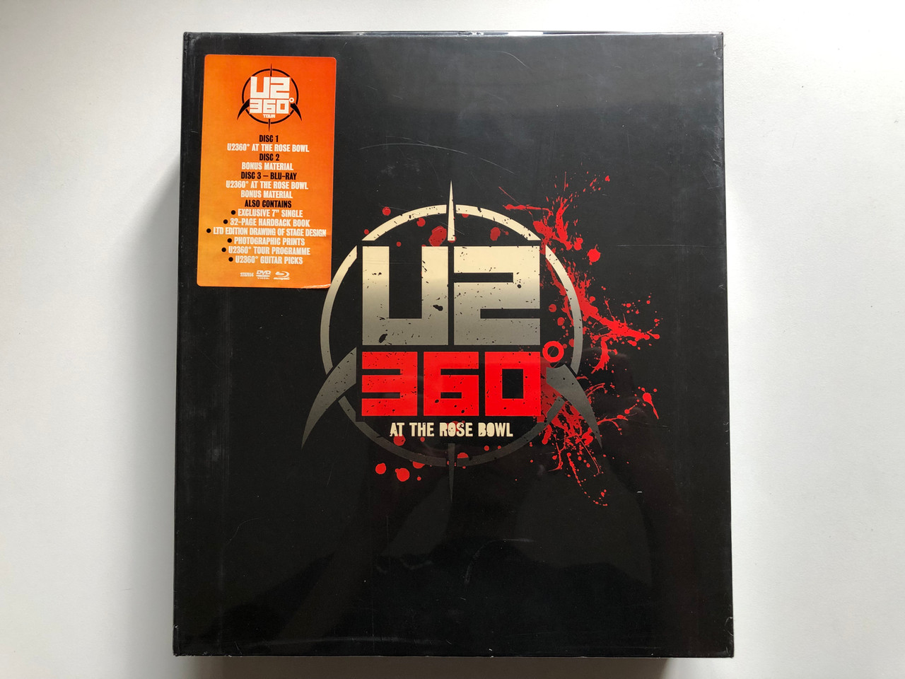 https://cdn11.bigcommerce.com/s-62bdpkt7pb/products/0/images/338850/U2360_At_The_Rose_Bowl_Disc_1_U2360_At_The_Rose_Bowl_Disc_2_Bonus_Material_Disc_3_-_Blu-Ray_U2360_At_The_Rose_Bowl_Bonus_Material_Also_contains_Exclusive_7_Single_32-page_hardback_1__80143.1719565368.1280.1280.JPG?c=2