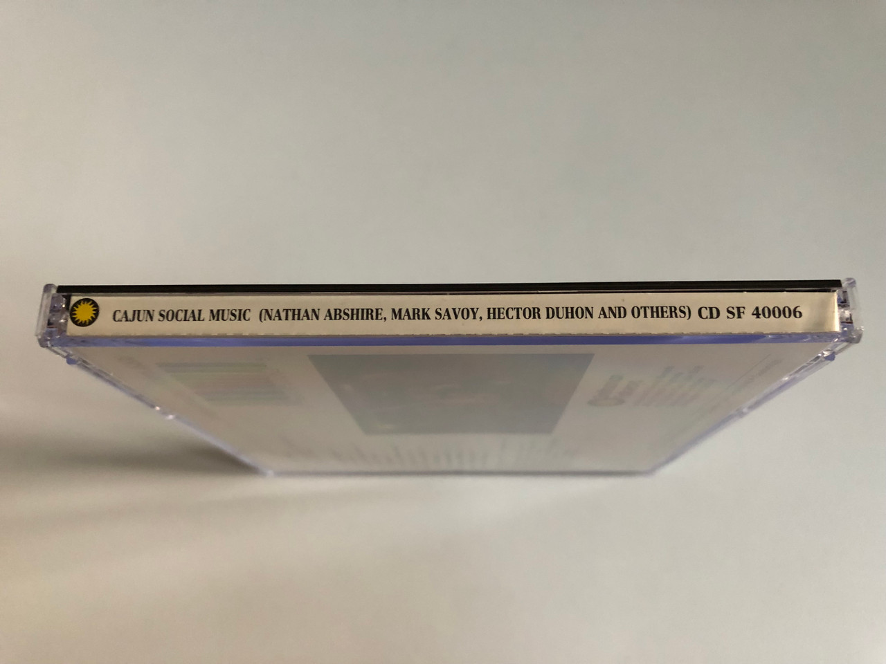 https://cdn11.bigcommerce.com/s-62bdpkt7pb/products/0/images/343861/Cajun_Social_Music_-_Featuring_Nathan_Abshire_Mark_Savoy_Hector_Duhon_and_Others_Smithsonian_Folkways_Audio_CD_1990_CD_SF_40006_3__17108.1723177734.1280.1280.JPG?c=2