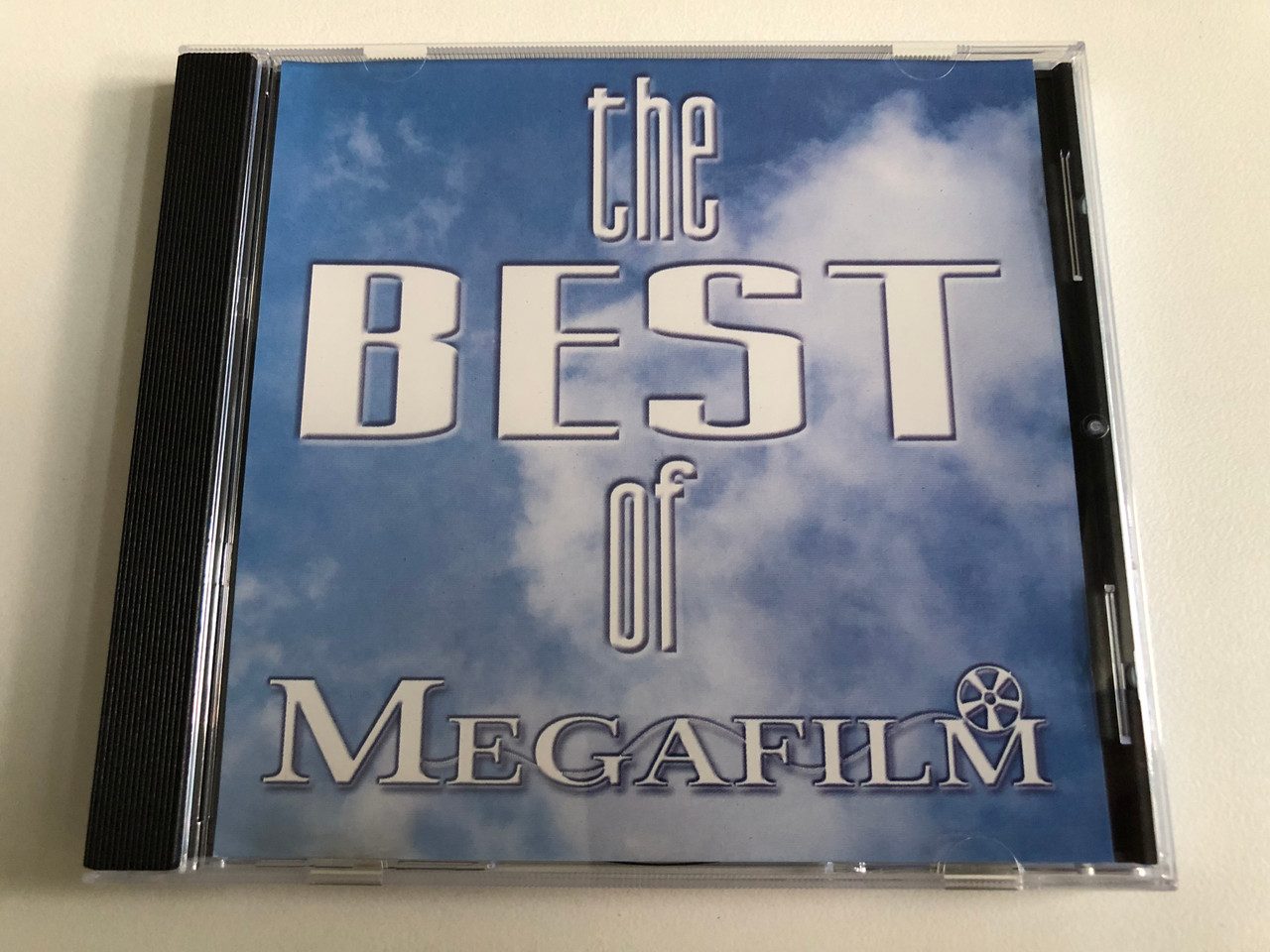 https://cdn11.bigcommerce.com/s-62bdpkt7pb/products/0/images/344647/The_Best_Of_Megafilm_Megafilm_Audio_CD_98003_1__32688.1723655607.1280.1280.JPG?c=2