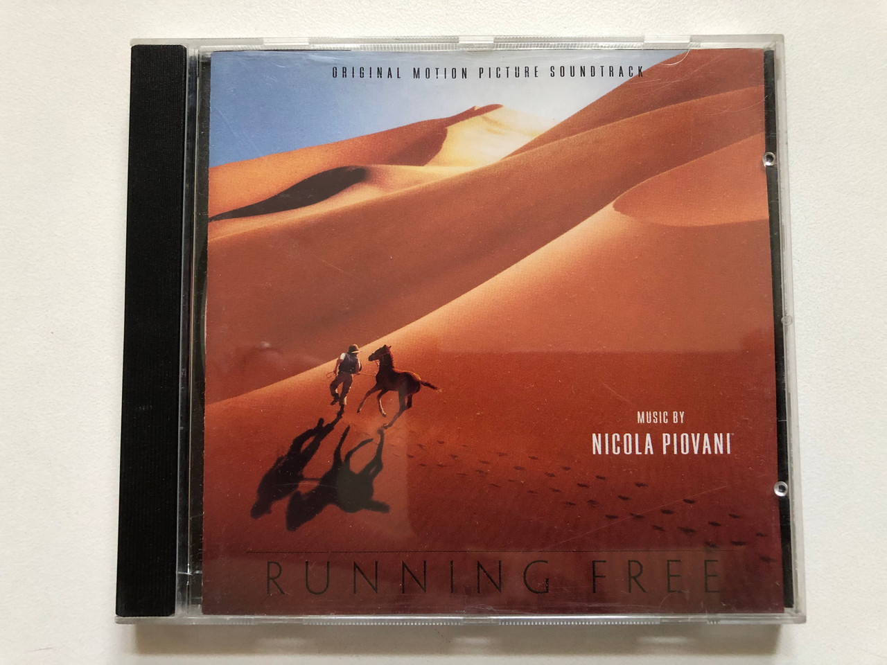 https://cdn11.bigcommerce.com/s-62bdpkt7pb/products/0/images/347128/Running_Free_-_Music_By_Nicola_Piovani_Original_Motion_Picture_Soundtrack_Varse_Sarabande_Audio_CD_2000_VSD-6152_1__22619.1724905143.1280.1280.JPG?c=2