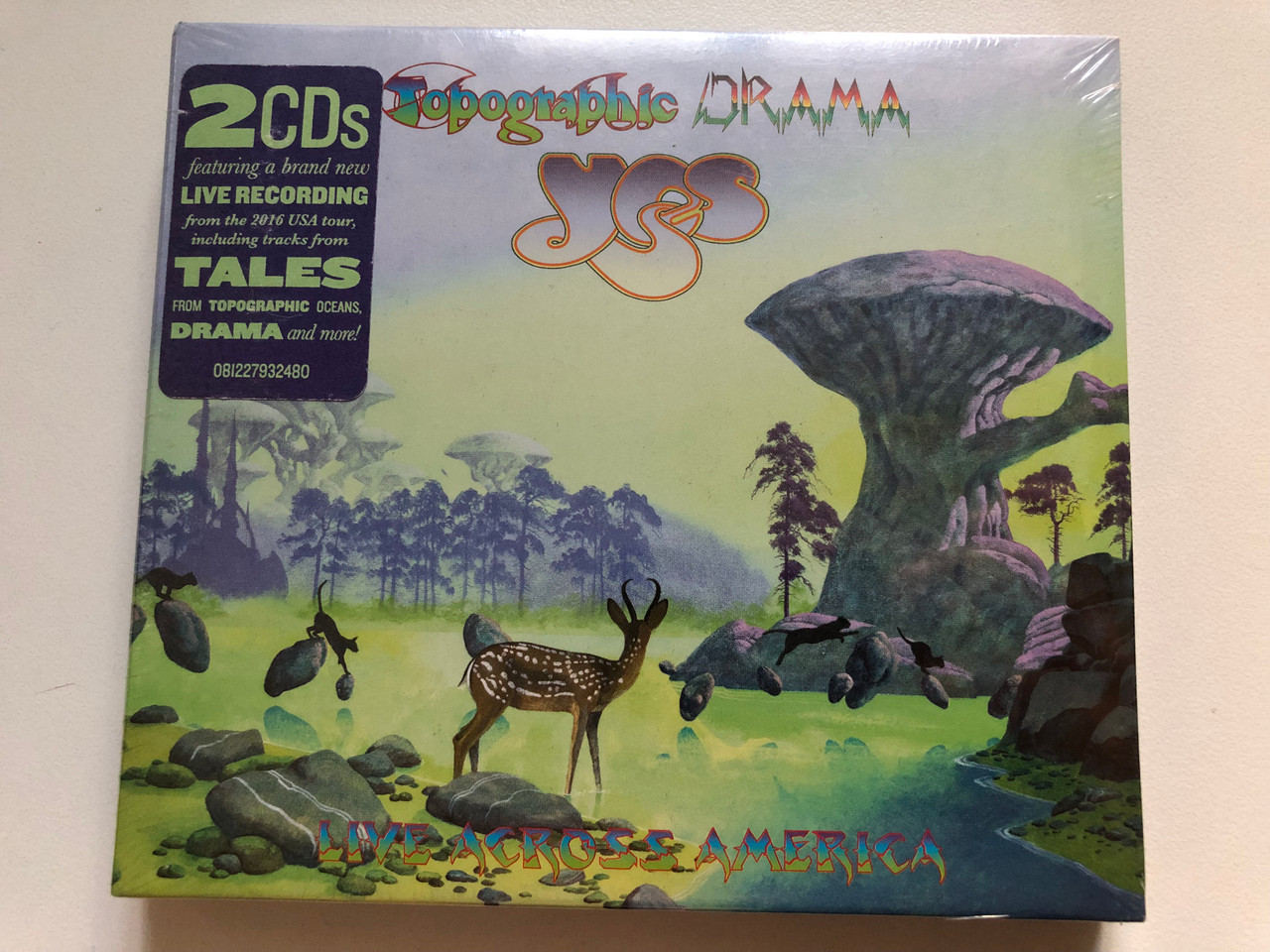 https://cdn11.bigcommerce.com/s-62bdpkt7pb/products/0/images/349005/Yes_Topographic_Drama_Live_Across_America_featuring_a_brand_new_Live_Recording_from_the_2016_USA_tour_including_tracks_from_Tales_from_Topographic_Oceans_Drama_and_more_Rhino_Records_1__07370.1727089824.1280.1280.JPG?c=2