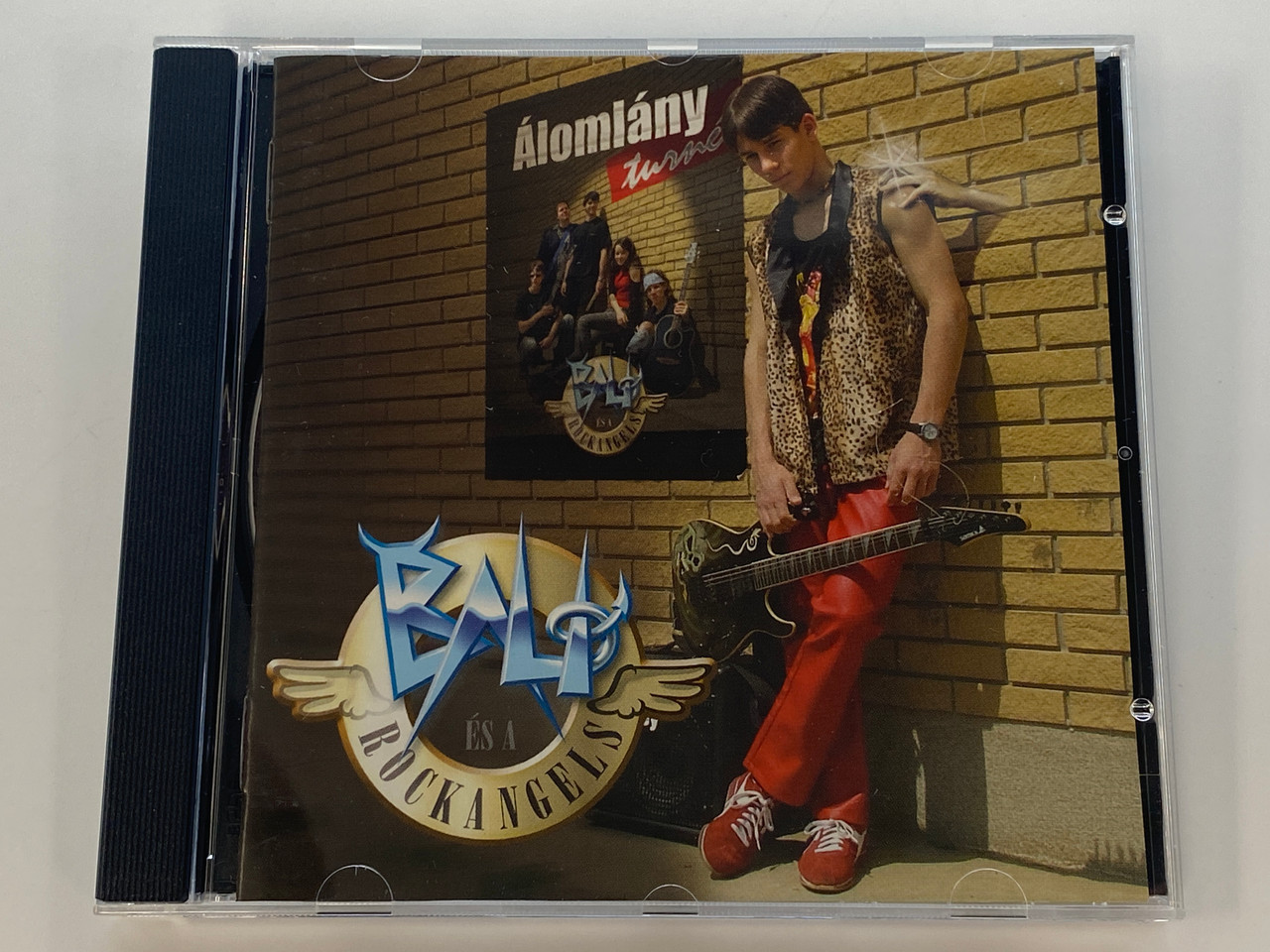 https://cdn11.bigcommerce.com/s-62bdpkt7pb/products/0/images/350978/Bali_s_A_Rockangels_lomlny_NAS_Kft._Audio_CD_2004_PAR04012_1__81659.1727881470.1280.1280.jpg?c=2