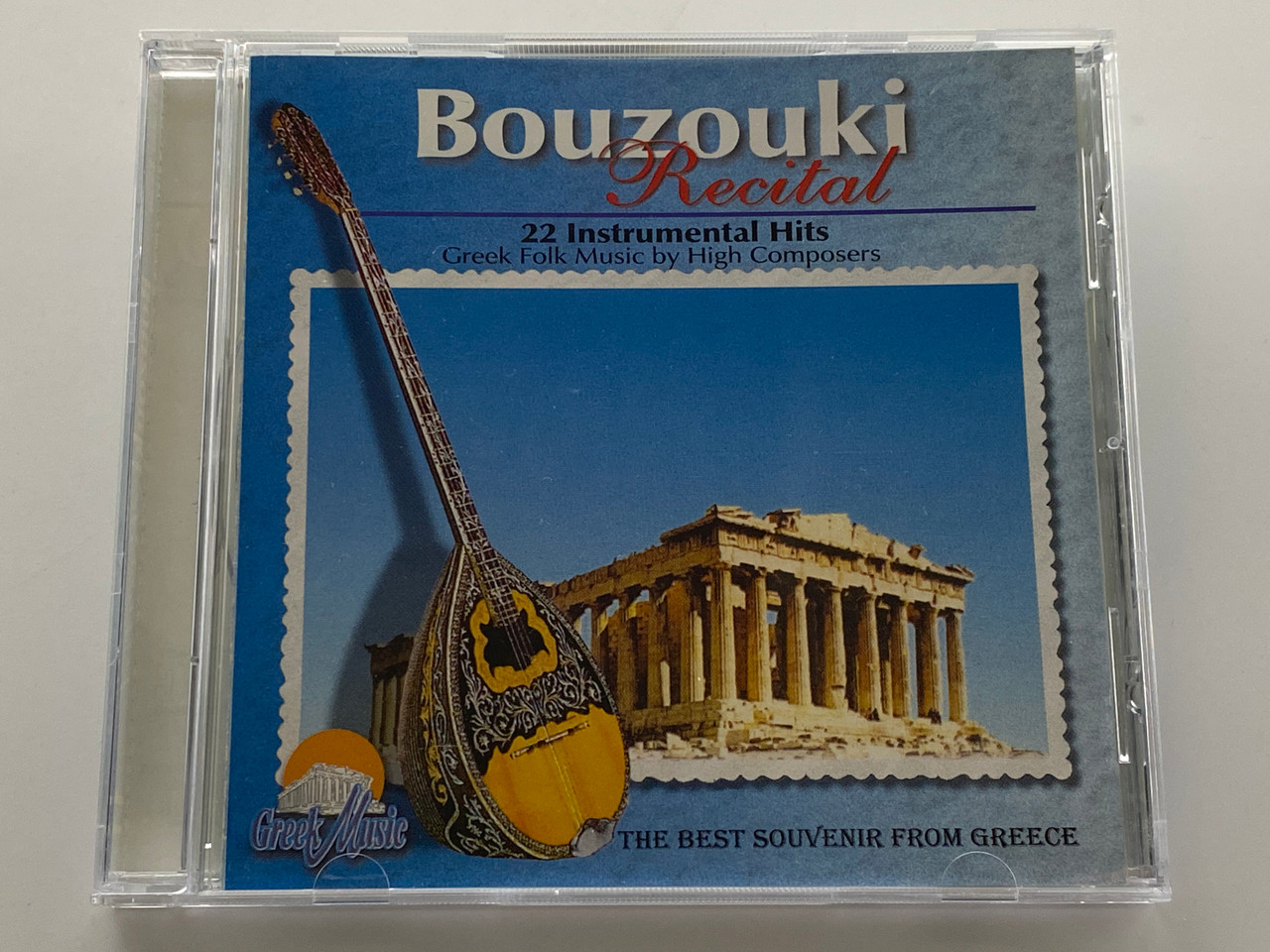 https://cdn11.bigcommerce.com/s-62bdpkt7pb/products/0/images/351336/Bouzouki_Recital_-_22_Instrumental_Hits_Greek_Folk_Music_by_High_Composers_The_Best_Souvenir_From_Greece_Melcophone_Audio_CD_ADD_1526_1__70308.1727953382.1280.1280.jpg?c=2