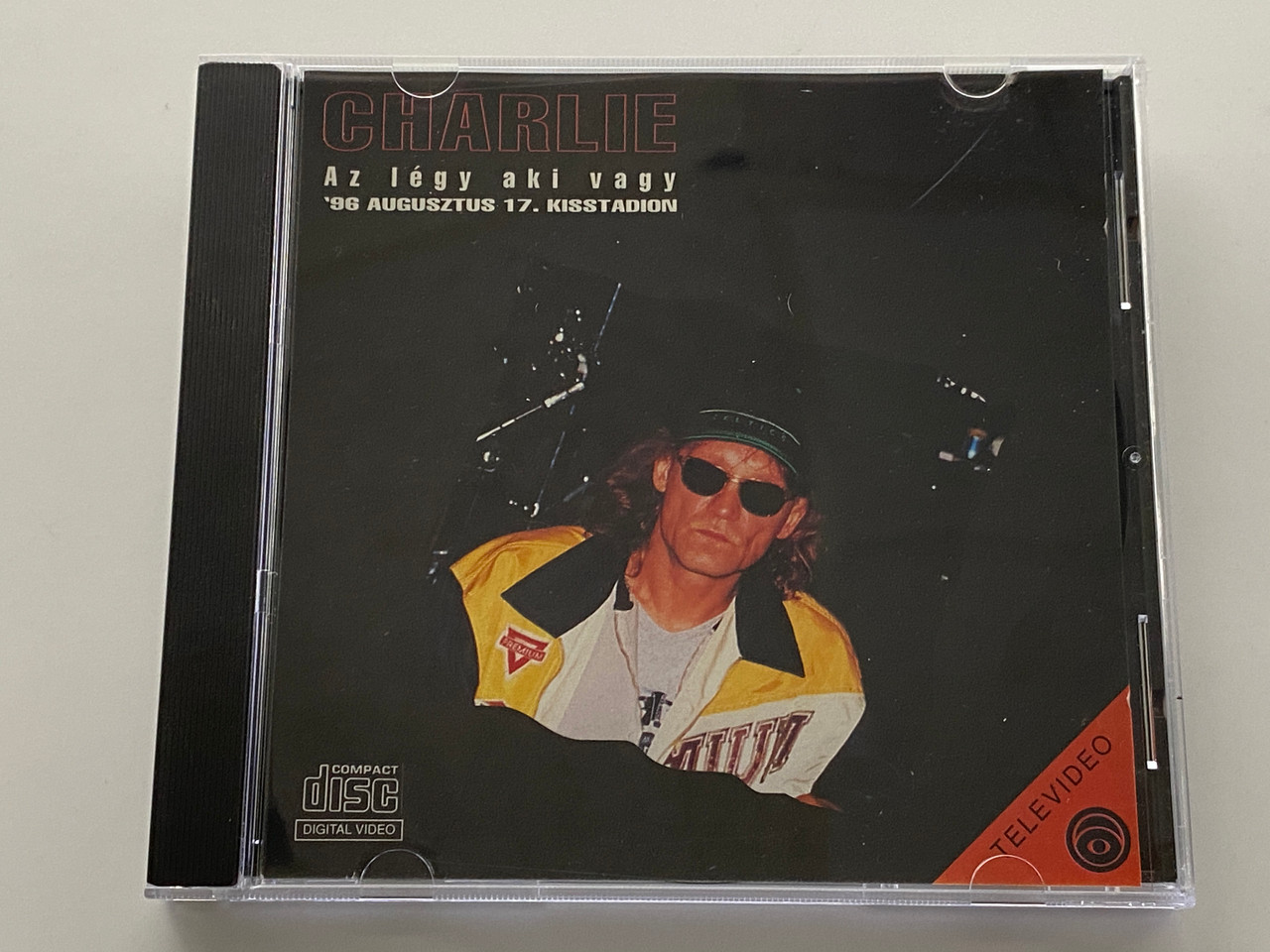 https://cdn11.bigcommerce.com/s-62bdpkt7pb/products/0/images/351927/Charlie_Az_Lgy_Aki_Vagy_96_Augusztus_17._Kisstadion_Rzsa_Records_Audio_CD_1996_1__54796.1728038448.1280.1280.jpg?c=2