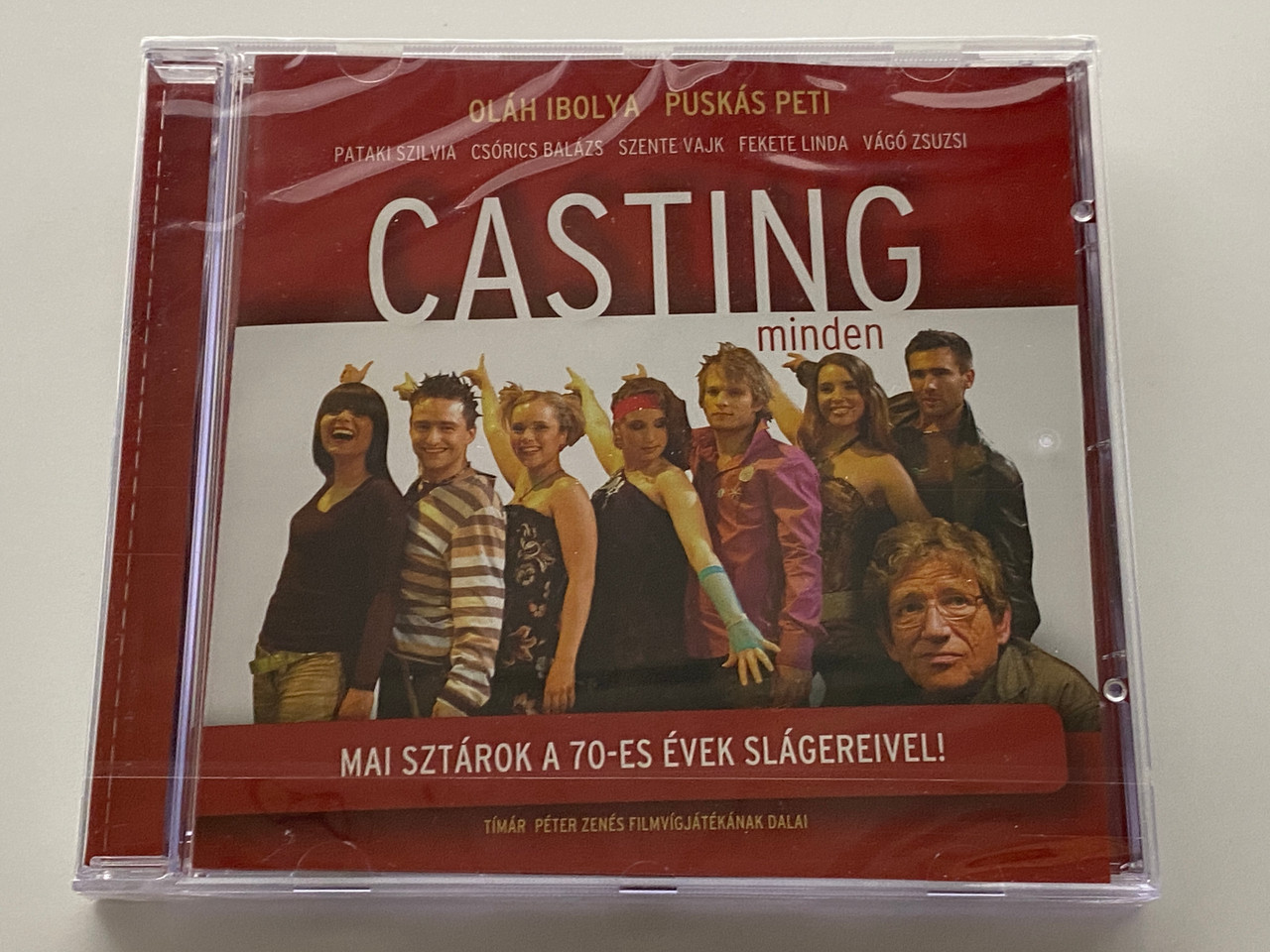 https://cdn11.bigcommerce.com/s-62bdpkt7pb/products/0/images/352507/Olah_Ibolya_Puskas_Peti_Pataki_Szilvia_Csorics_Balazs_Szente_Vajk_Fekete_Linda_Vago_Zsuzsi_Casting_Minden_-_Mai_Sztarok_A_70-Es_Evek_Slagereivel_Timar_Peter_Zenes_Filmvigjatekanak_Dala_1__83785.1728295518.1280.1280.jpg?c=2
