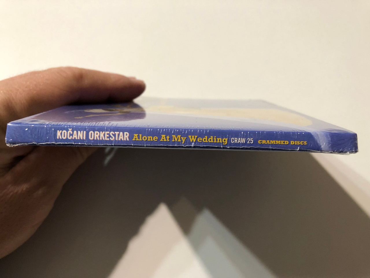 https://cdn11.bigcommerce.com/s-62bdpkt7pb/products/0/images/353684/Koani_Orkestar_Alone_At_My_Wedding_Crammed_Discs_Audio_CD_2002_CRAW_25_3__10713.1728550375.1280.1280.JPG?c=2