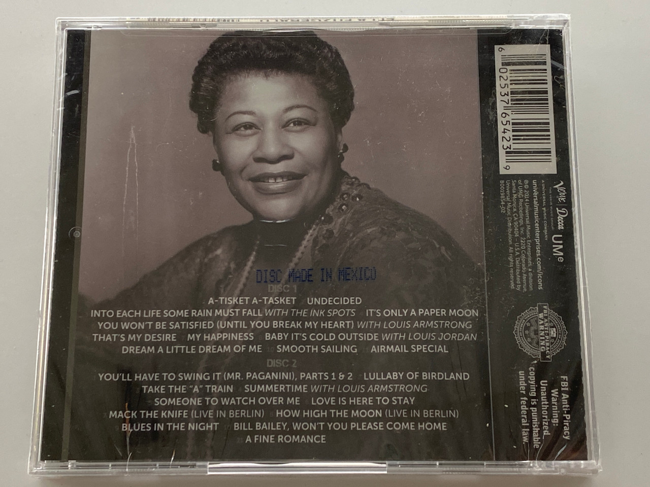 https://cdn11.bigcommerce.com/s-62bdpkt7pb/products/0/images/354377/Ella_Fitzgerald_ICON_2_-_Featuring_A-Tisket_A-Tasket_Its_Only_A_Paper_Moon_Airmail_Special_Youll_Have_To_Swing_It_Parts_1_2_Lullaby_Of_Birdland_Take_The_A_Train_Summertime_Lov__03803.1729071949.1280.1280.jpg?c=2