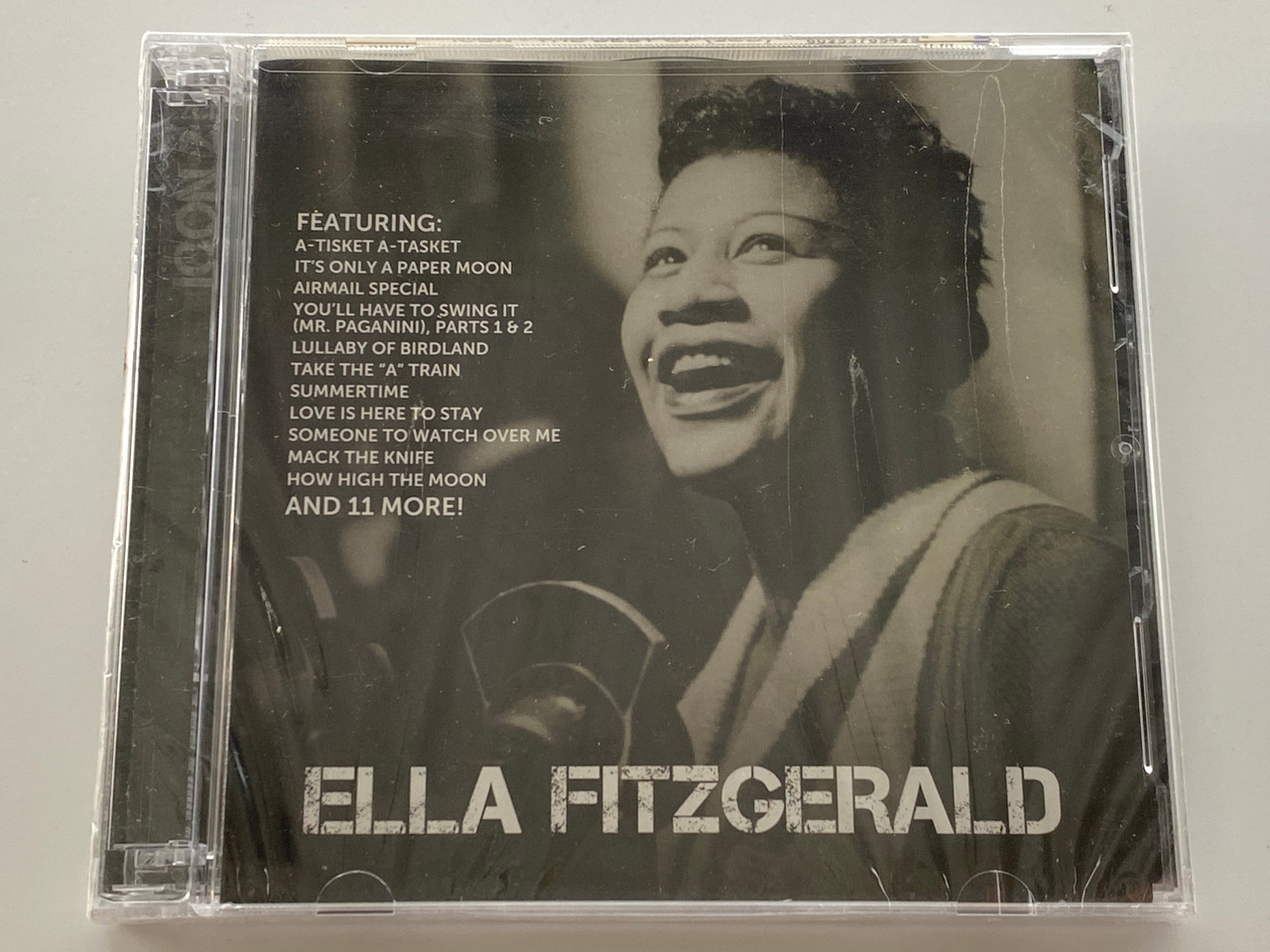 https://cdn11.bigcommerce.com/s-62bdpkt7pb/products/0/images/354378/Ella_Fitzgerald_ICON_2_-_Featuring_A-Tisket_A-Tasket_Its_Only_A_Paper_Moon_Airmail_Special_Youll_Have_To_Swing_It_Parts_1_2_Lullaby_Of_Birdland_Take_The_A_Train_Summertime_Love_I_1__68148.1729071954.1280.1280.jpg?c=2