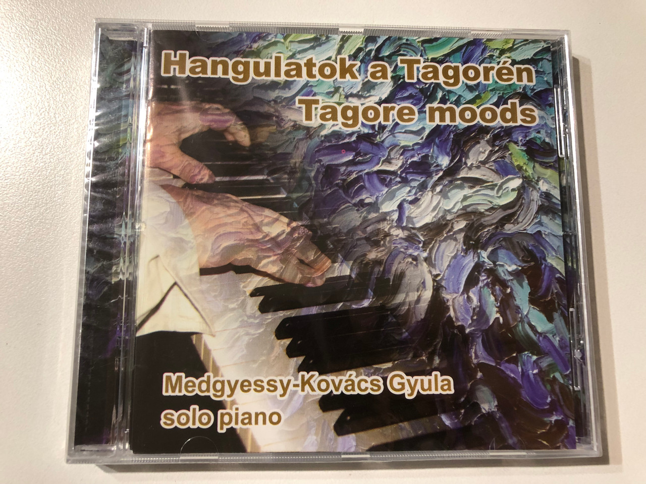 https://cdn11.bigcommerce.com/s-62bdpkt7pb/products/0/images/354745/Hangulatok_a_Tagoren_Tagore_moods_-_Medgyessy-Kovacs_Gyula_solo_piano_BMM_Audio_CD_2016_BMM201603102505067_1__44414.1729154481.1280.1280.JPG?c=2