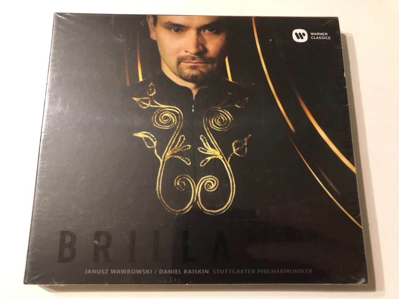 https://cdn11.bigcommerce.com/s-62bdpkt7pb/products/0/images/354811/Brillante_-_Janusz_Wawrowski_Daniel_Raiskin_Stuttgarter_Philharmoniker_Warner_Classics_Audio_CD_2017_0190295808440_1__82794.1729189409.1280.1280.JPG?c=2