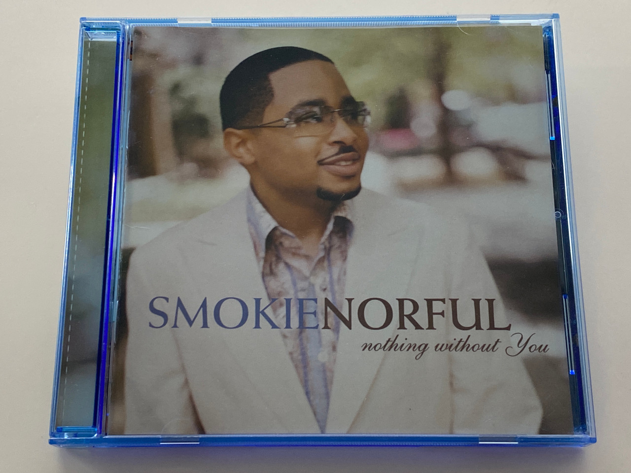 https://cdn11.bigcommerce.com/s-62bdpkt7pb/products/0/images/356341/Smokie_Norful_Nothing_Without_You_EMI_Gospel_Audio_CD_2004_724357779500_1__17369.1729605515.1280.1280.jpg?c=2
