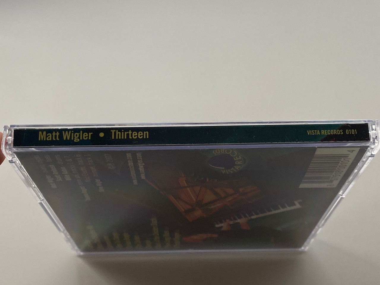 https://cdn11.bigcommerce.com/s-62bdpkt7pb/products/0/images/356352/Matt_Wigler_-_Thirteen_Vista_Records_Aduio_CD_2007_0101_3__59162.1729606787.1280.1280.jpg?c=2