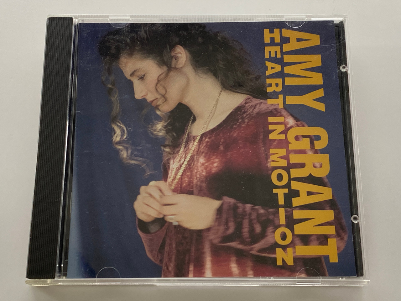 https://cdn11.bigcommerce.com/s-62bdpkt7pb/products/0/images/356629/Amy_Grant_Heart_In_Motion_AM_Records_Audio_CD_75021_5321_2_1__54531.1729791164.1280.1280.jpg?c=2