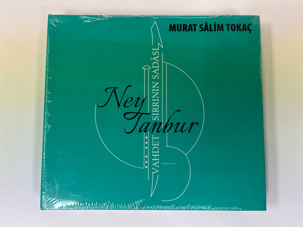 https://cdn11.bigcommerce.com/s-62bdpkt7pb/products/0/images/357929/Murat_Salim_Tokac_-_Ney_Tanbur_-_Yahdet_Sirrinin_Sadasi_Yenikapi_Muzik_Uretim_2x_Audio_CD_1__57417.1730493385.1280.1280.JPG?c=2