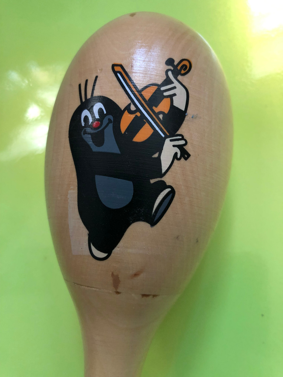 https://cdn11.bigcommerce.com/s-62bdpkt7pb/products/0/images/384144/The_Little_Mole_Krtek_image_of_playing_a_violin_on_a_wooden_maraca_toy_for_children_2__29865.1758571167.1280.1280.JPG?c=2