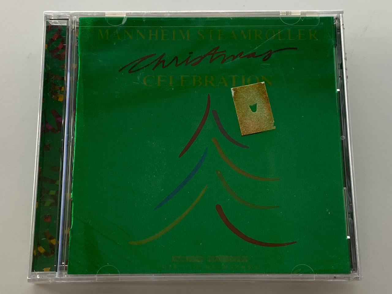 https://cdn11.bigcommerce.com/s-62bdpkt7pb/products/70539/images/354381/Mannheim_Steamroller_Christmas_Celebration_American_Gramaphone_Records_Audio_CD_2004_AG-2020-2_1__18739.1729073881.1280.1280.jpg?c=2