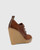Tablyn Brown Suede and Leather Round Toe Wedge Bootie. 
