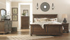 Flynnter Medium Brown 7 Pc. Dresser, Mirror, Chest, Queen Panel Bed & Nightstand