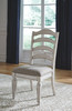 Realyn Chipped White 7 Pc. Oval EXT Table & 6 UPH Side Chairs