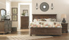 Flynnter Medium Brown 7 Pc. Dresser, Mirror, Chest, Queen Panel Bed with Storage & Nightstand