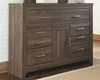 Juararo Dark Brown 7 Pc. Dresser, Mirror, California King Panel Bed & 2 Nightstands