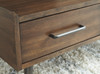 Calmoni Brown Rectangular Cocktail Table