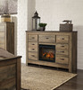 Trinell Brown Dresser With Faux Firebrick Fireplace Insert