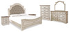 Realyn King Upholstered Panel Bed, Dresser, Mirror, Chest and 2 Nightstands (B743B37)