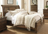 Flynnter Medium Brown Queen Sleigh Storage Bed