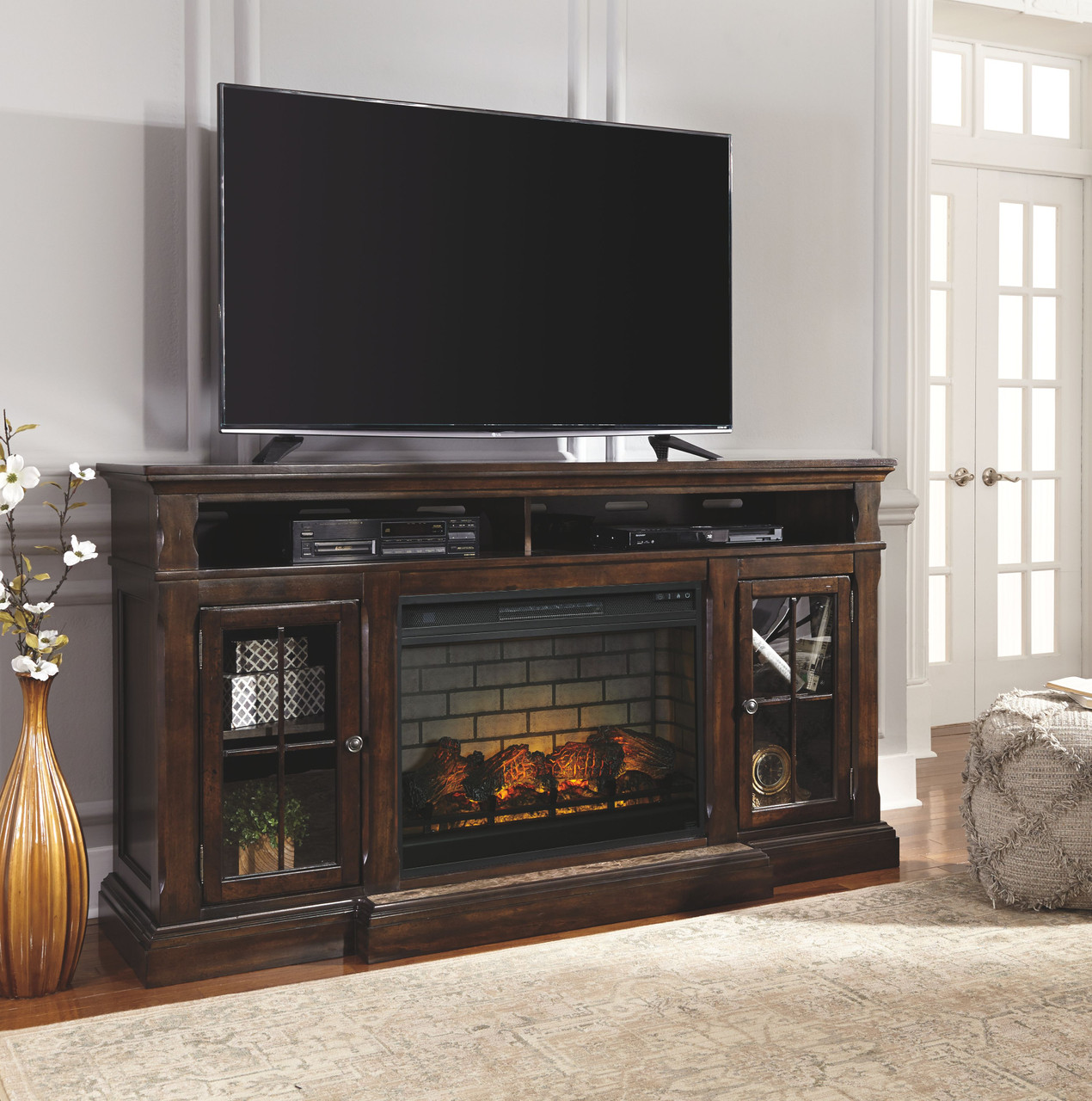 The Roddinton Dark Brown XL TV Stand with LG Fireplace Insert Infrared  available at Rose Brothers Furniture serving Wilmington, Jacksonville NC  and surrounding areas.