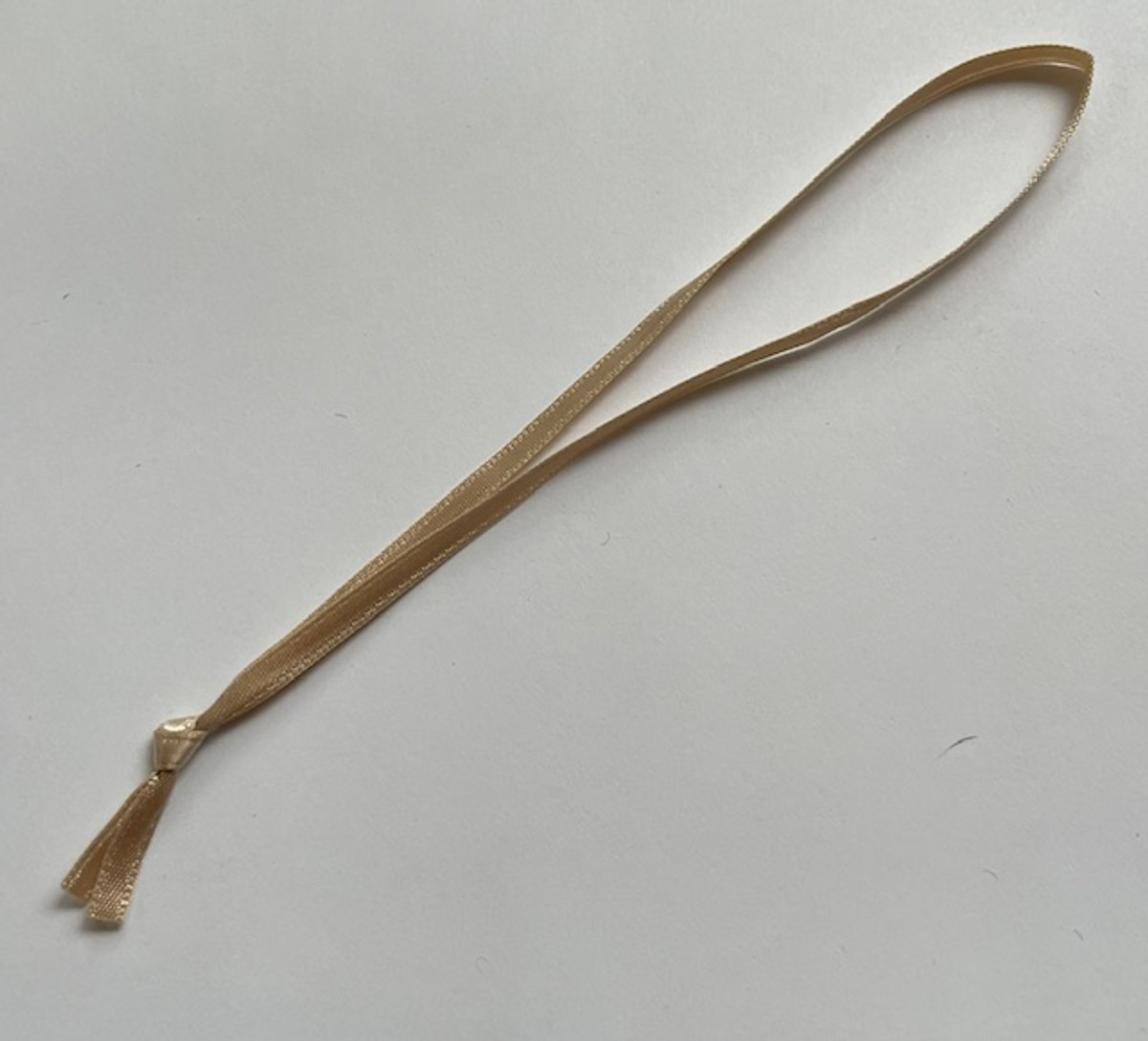 1/8' wide Champagne satin, 5" long knotted loop