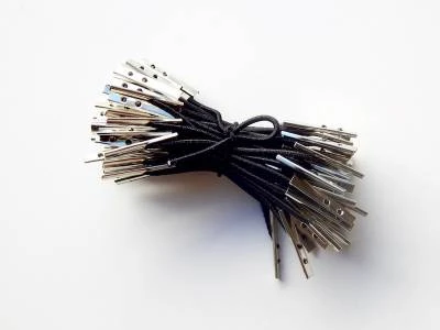 Barbed each end elastic for securing pages or products
