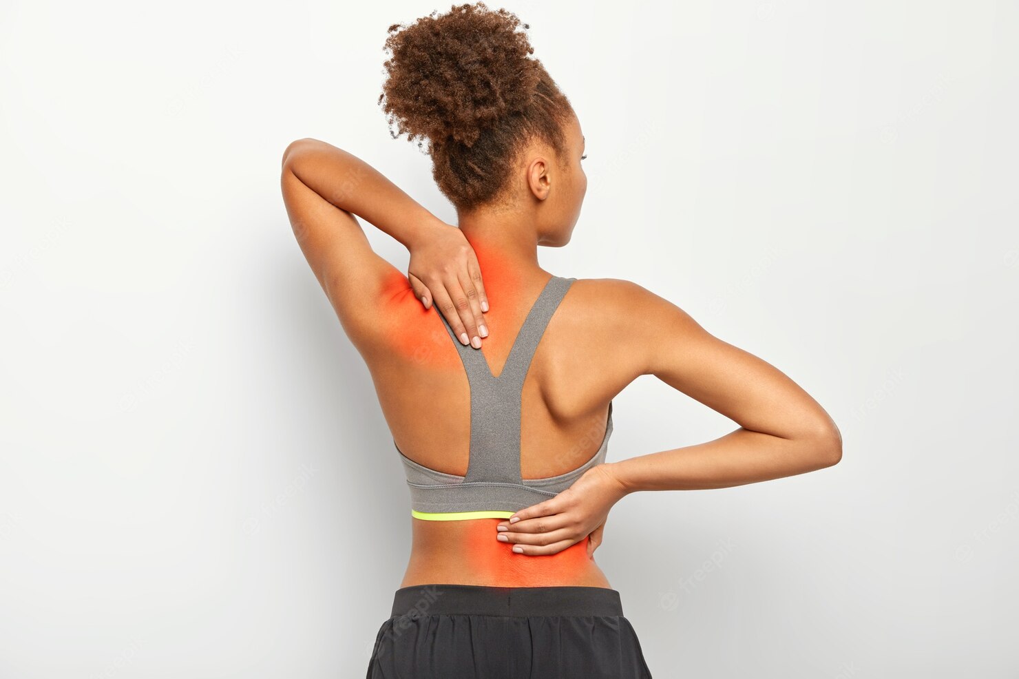 woman grabbing back and neck in pain