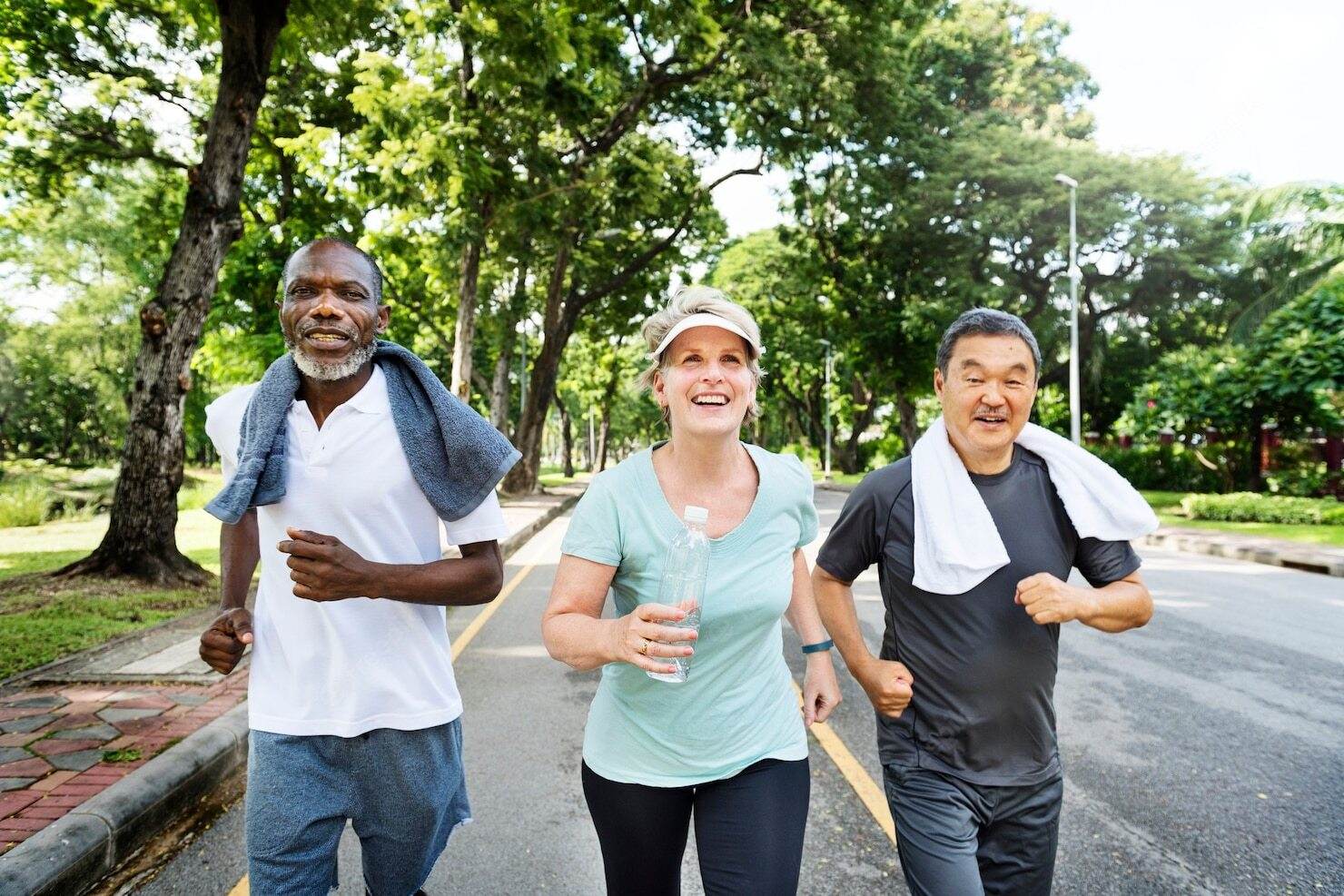 group of seniors walking happily down the street together